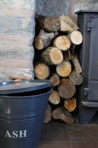 ash bin and stacked wood